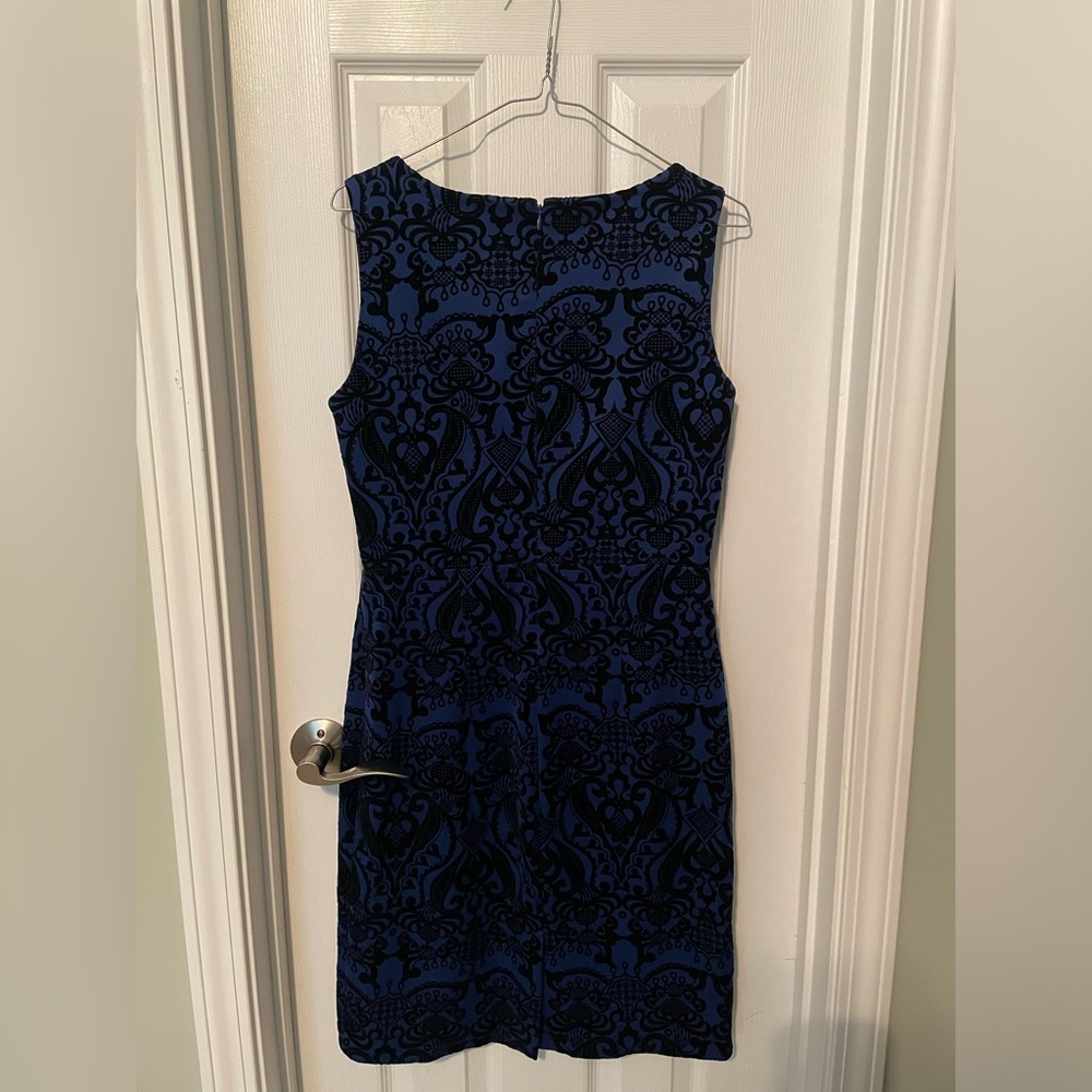 Indication. Blue and black jacquard dress.